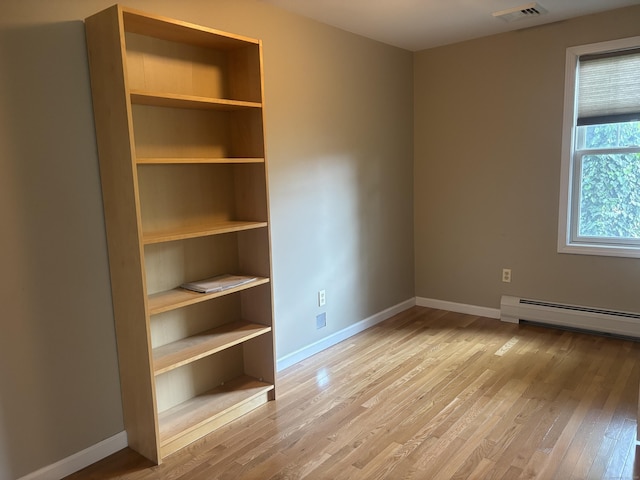 14 N Washington Ave, East Lyme, CT 06357 - spare room with baseboard heating and light wood finished floors