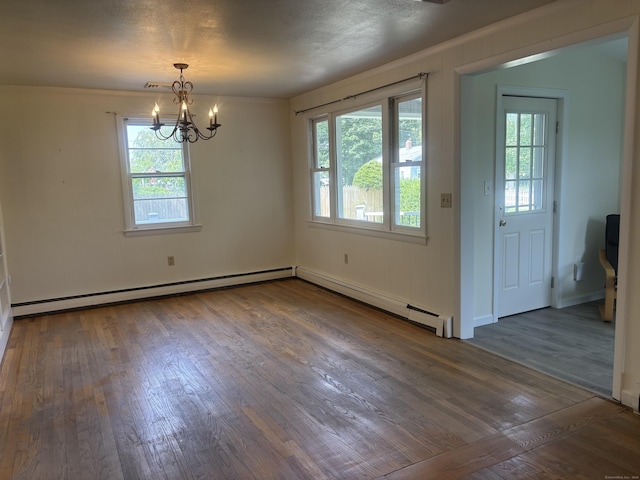 14 N Washington Ave, East Lyme, CT 06357 - unfurnished dining area featuring baseboard heating, wood finished floors, healthy amount of natural light, and a chandelier
