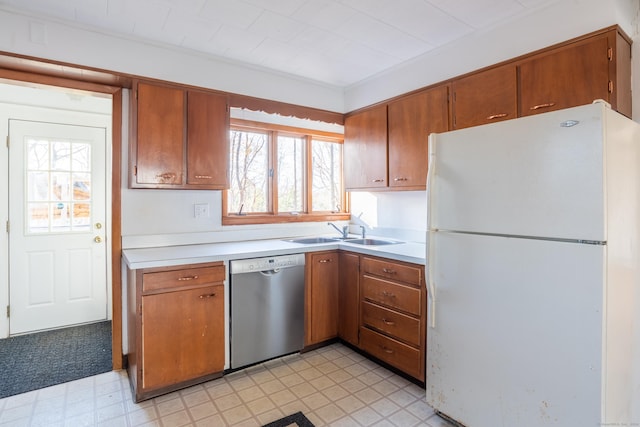 48 Jerusalem Hl, Trumbull, CT 06611 - kitchen with stainless steel dishwasher, a sink, light countertops, freestanding refrigerator, and light floors