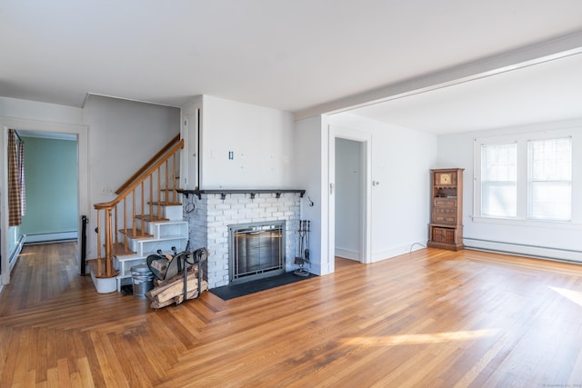 48 Jerusalem Hl, Trumbull, CT 06611 - living area with baseboards, a baseboard heating unit, a fireplace, and stairway
