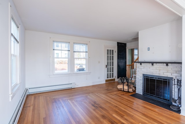 48 Jerusalem Hl, Trumbull, CT 06611 - unfurnished living room featuring a healthy amount of sunlight, a baseboard radiator, and a brick fireplace