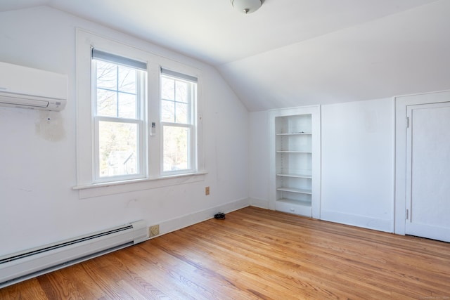 48 Jerusalem Hl, Trumbull, CT 06611 - additional living space with baseboard heating, an AC wall unit, built in shelves, and lofted ceiling