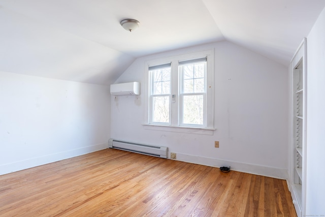 48 Jerusalem Hl, Trumbull, CT 06611 - additional living space with baseboards, wood finished floors, a baseboard heating unit, vaulted ceiling, and a wall mounted AC