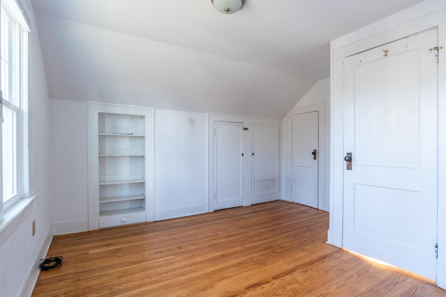 48 Jerusalem Hl, Trumbull, CT 06611 - bonus room with baseboards, built in shelves, lofted ceiling, and light wood-type flooring