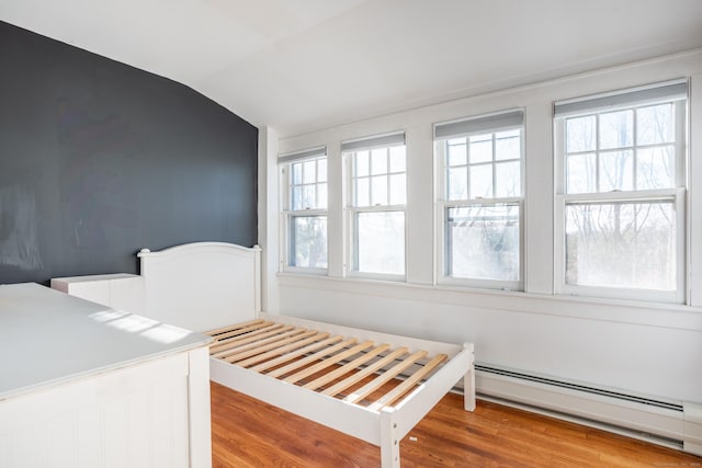48 Jerusalem Hl, Trumbull, CT 06611 - unfurnished bedroom with a baseboard heating unit, wood finished floors, and lofted ceiling