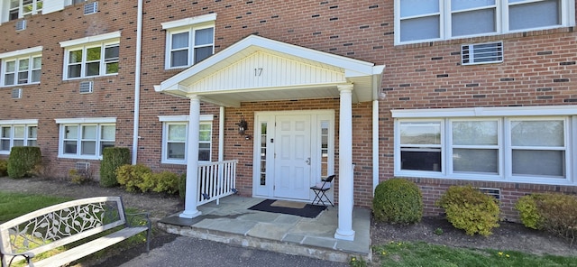 property entrance with brick siding