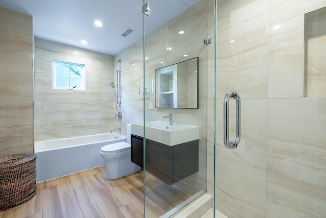 bathroom with vanity, toilet, recessed lighting, bathing tub / shower combination, and visible vents