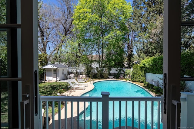 view of swimming pool with a patio, a fenced backyard, and a fenced in pool