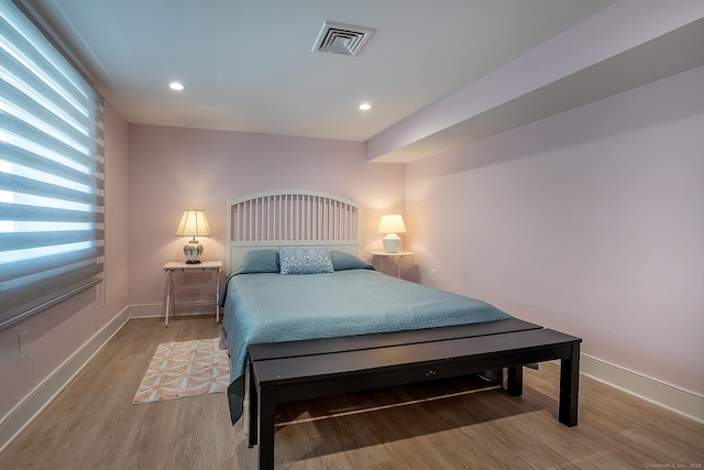 bedroom with recessed lighting, baseboards, visible vents, and light wood-style floors