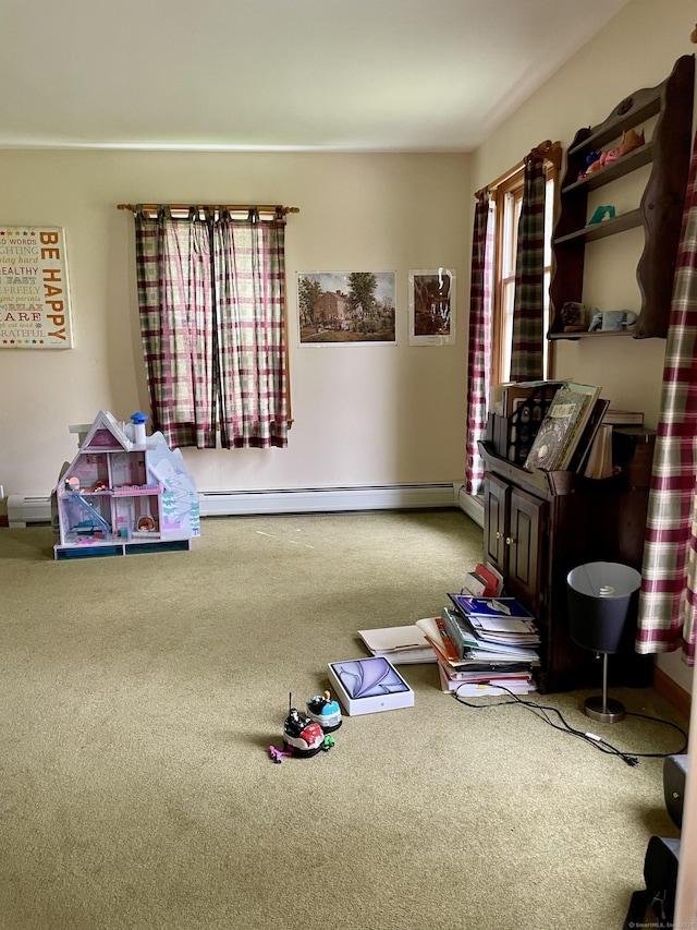 recreation room with a baseboard heating unit, baseboard heating, and carpet