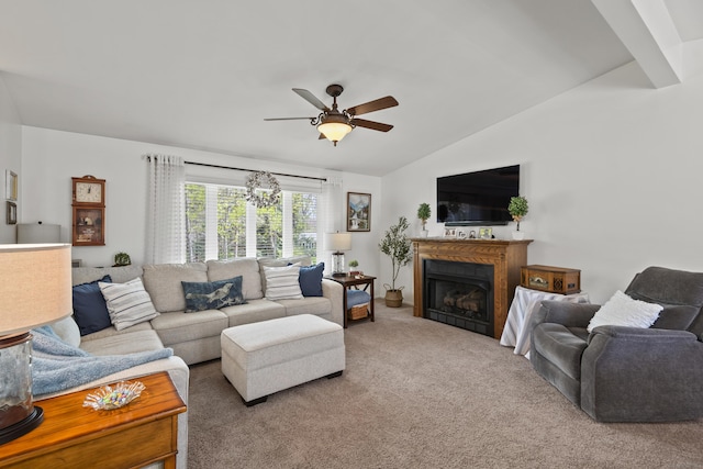 carpeted living room with lofted ceiling, a fireplace, and a ceiling fan