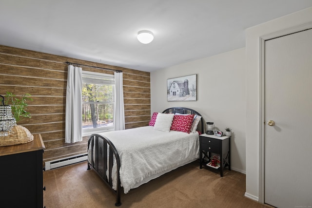 carpeted bedroom with wooden walls and baseboard heating