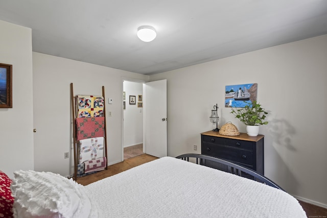 carpeted bedroom with baseboards