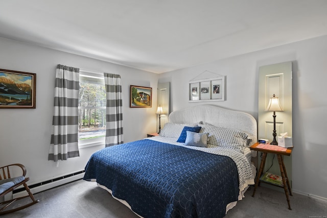 bedroom featuring a baseboard heating unit, carpet flooring, and baseboards