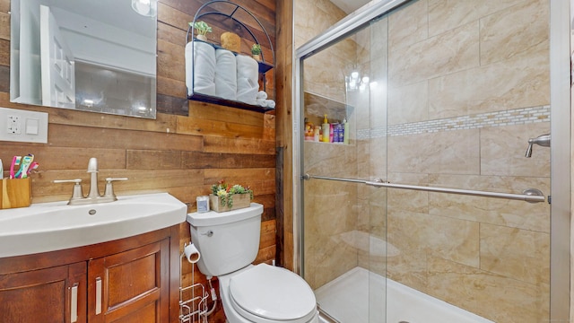 full bath featuring a shower stall, toilet, and vanity