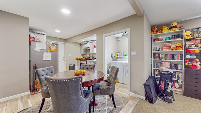 dining room with recessed lighting, washer and dryer, light wood finished floors, and baseboards