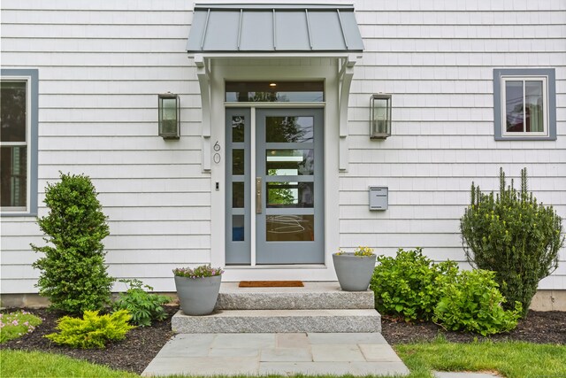 60 Eleanor Ter, Fairfield, CT 06824 - view of exterior entry featuring a standing seam roof