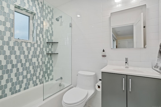 60 Eleanor Ter, Fairfield, CT 06824 - full bath featuring tile walls, vanity, toilet, and combined bath / shower with glass door