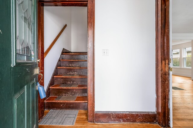 stairway with wood finished floors