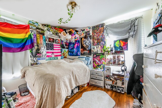bedroom with wood finished floors