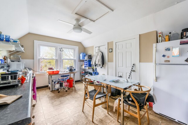 dining area featuring attic access and lofted ceiling