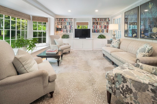 living area with recessed lighting and built in features