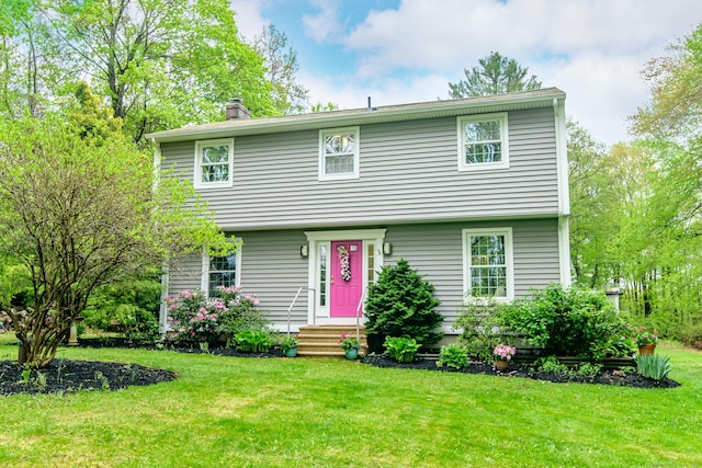 104 Pulpit Rock Rd, Woodstock, CT 06281 - colonial-style house featuring a chimney and a front lawn