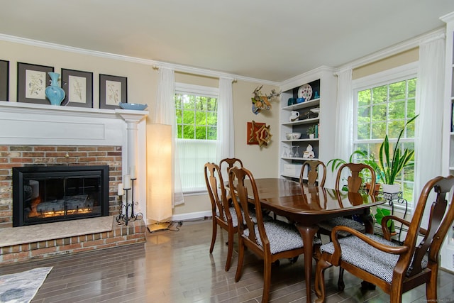 104 Pulpit Rock Rd, Woodstock, CT 06281 - dining area featuring plenty of natural light, wood finished floors, crown molding, and a brick fireplace