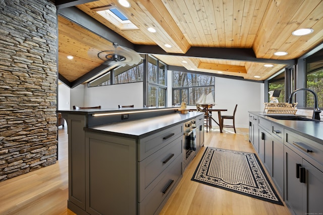 187 Sherbrook Dr, Goshen, CT 06756 - kitchen featuring gray cabinetry, wooden ceiling, light wood finished floors, and a sink