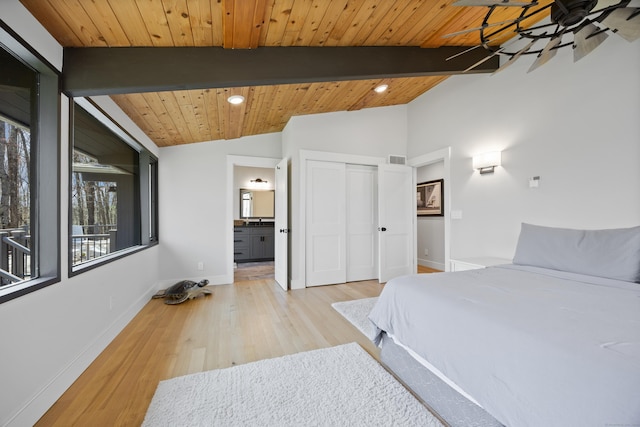 187 Sherbrook Dr, Goshen, CT 06756 - bedroom with vaulted ceiling with beams, wood finished floors, a closet, baseboards, and visible vents