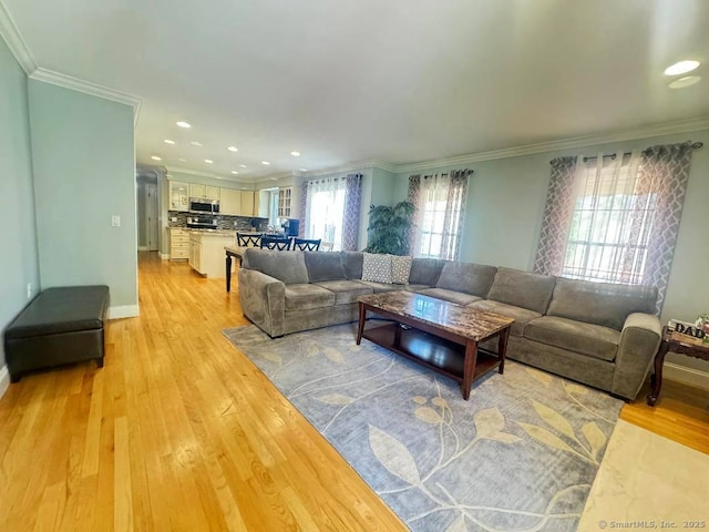 598 Nichols Ave, Stratford, CT 06614 - living room with crown molding, recessed lighting, baseboards, and light wood-style floors