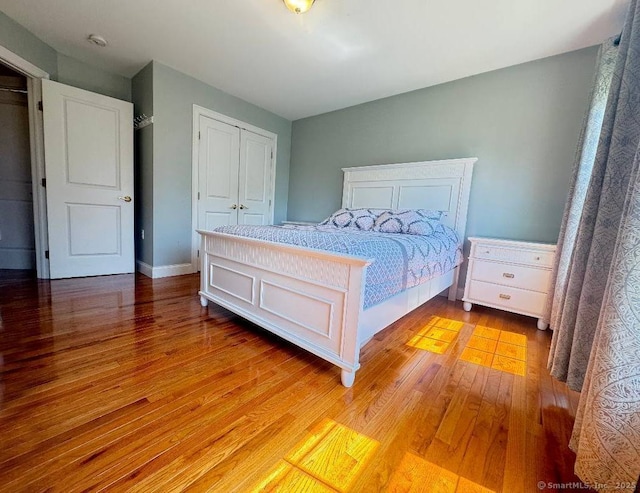 598 Nichols Ave, Stratford, CT 06614 - bedroom featuring a closet, baseboards, and light wood-type flooring