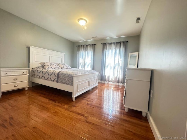 598 Nichols Ave, Stratford, CT 06614 - bedroom with dark wood-style flooring, baseboards, and visible vents