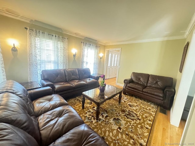 598 Nichols Ave, Stratford, CT 06614 - living area featuring crown molding, visible vents, and light wood-style flooring