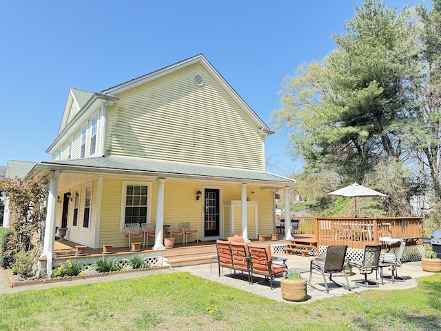 598 Nichols Ave, Stratford, CT 06614 - back of property featuring a yard and a patio