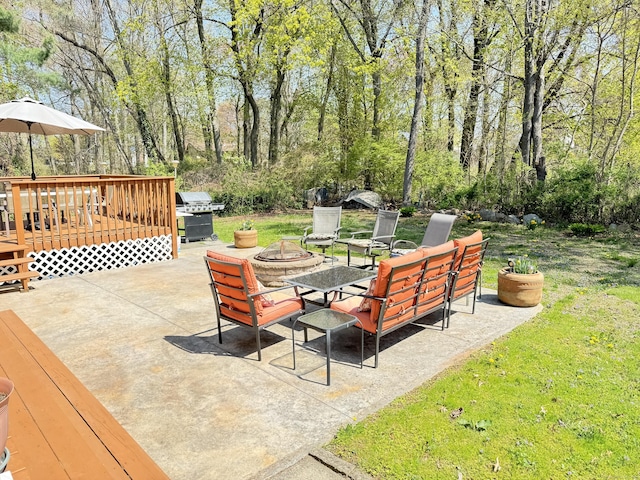 598 Nichols Ave, Stratford, CT 06614 - view of patio with area for grilling, a wooden deck, and a fire pit