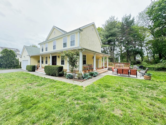 598 Nichols Ave, Stratford, CT 06614 - exterior space featuring covered porch, a yard, a garage, and aphalt driveway