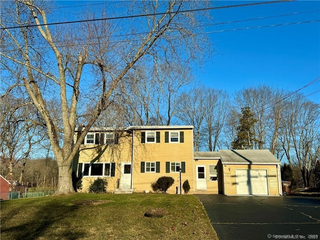 35 Marjorie Dr, North Branford, CT 06471 - traditional home with a front lawn, entry steps, an attached garage, and aphalt driveway
