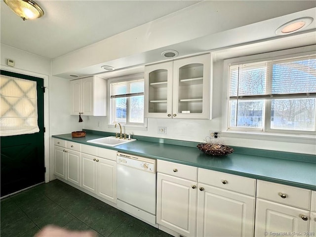 35 Marjorie Dr, North Branford, CT 06471 - kitchen with glass insert cabinets, dark tile patterned floors, white cabinets, dishwasher, and a sink