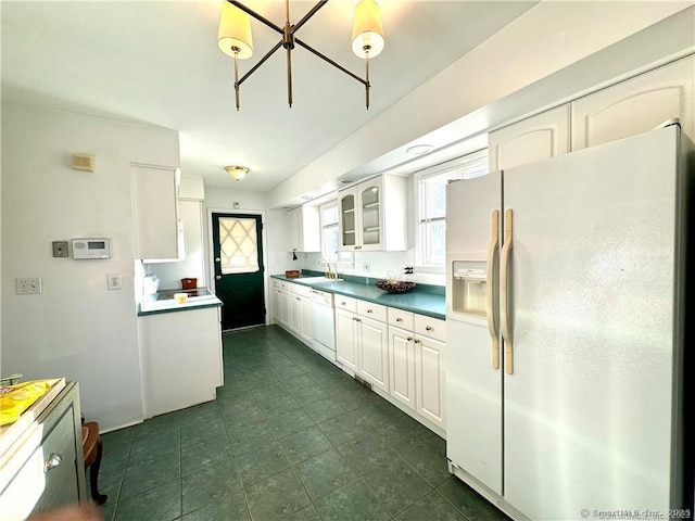 35 Marjorie Dr, North Branford, CT 06471 - kitchen featuring white appliances, glass insert cabinets, dark tile patterned flooring, white cabinets, and a sink