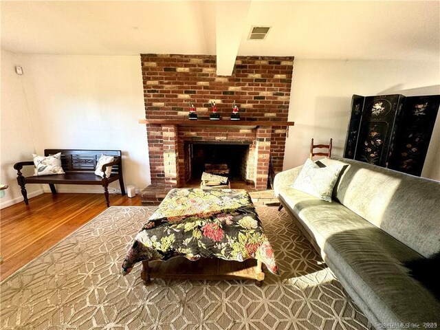35 Marjorie Dr, North Branford, CT 06471 - living room with beam ceiling, wood finished floors, and visible vents