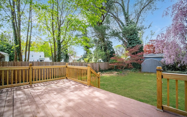 22 Hooker Dr, West Hartford, CT 06107 - deck featuring a storage unit, a fenced backyard, a yard, and an outdoor structure