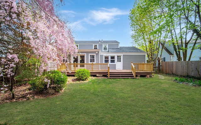 22 Hooker Dr, West Hartford, CT 06107 - rear view of house featuring fence, a wooden deck, and a lawn