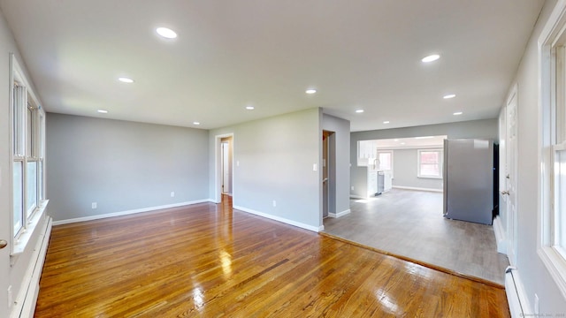 8 Batt St, Middletown, CT 06457 - spare room featuring baseboards, recessed lighting, wood finished floors, and a baseboard radiator