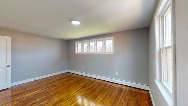 8 Batt St, Middletown, CT 06457 - empty room featuring a baseboard heating unit, wood finished floors, and baseboards