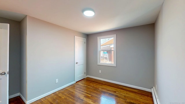 8 Batt St, Middletown, CT 06457 - unfurnished room with a baseboard heating unit, wood finished floors, and baseboards