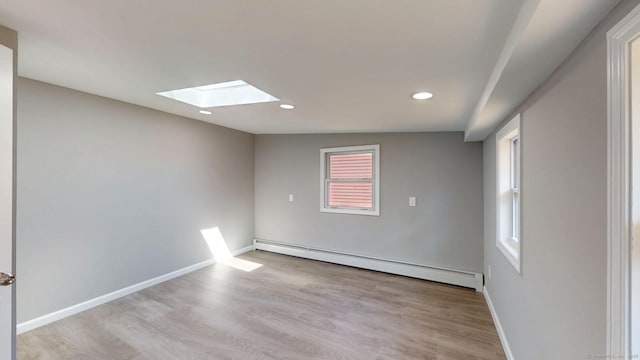 8 Batt St, Middletown, CT 06457 - spare room featuring baseboard heating, baseboards, recessed lighting, light wood finished floors, and a skylight