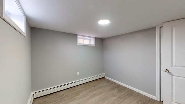 8 Batt St, Middletown, CT 06457 - basement featuring baseboards, light wood-style flooring, and a baseboard radiator