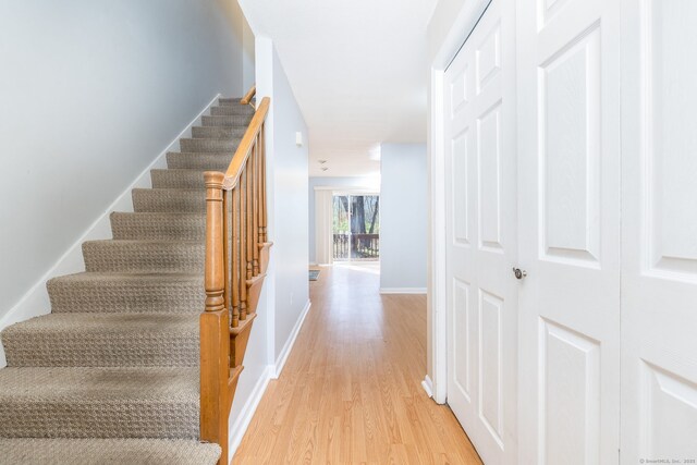 interior space featuring baseboards and wood finished floors