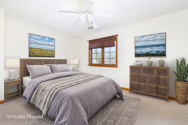 bedroom with baseboards and a ceiling fan